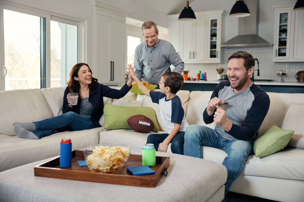 family watching football in the living room