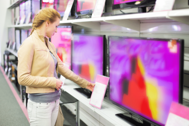 Woman shopping for televisions