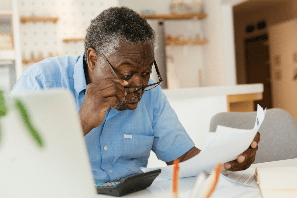 Old man upset with his bills.