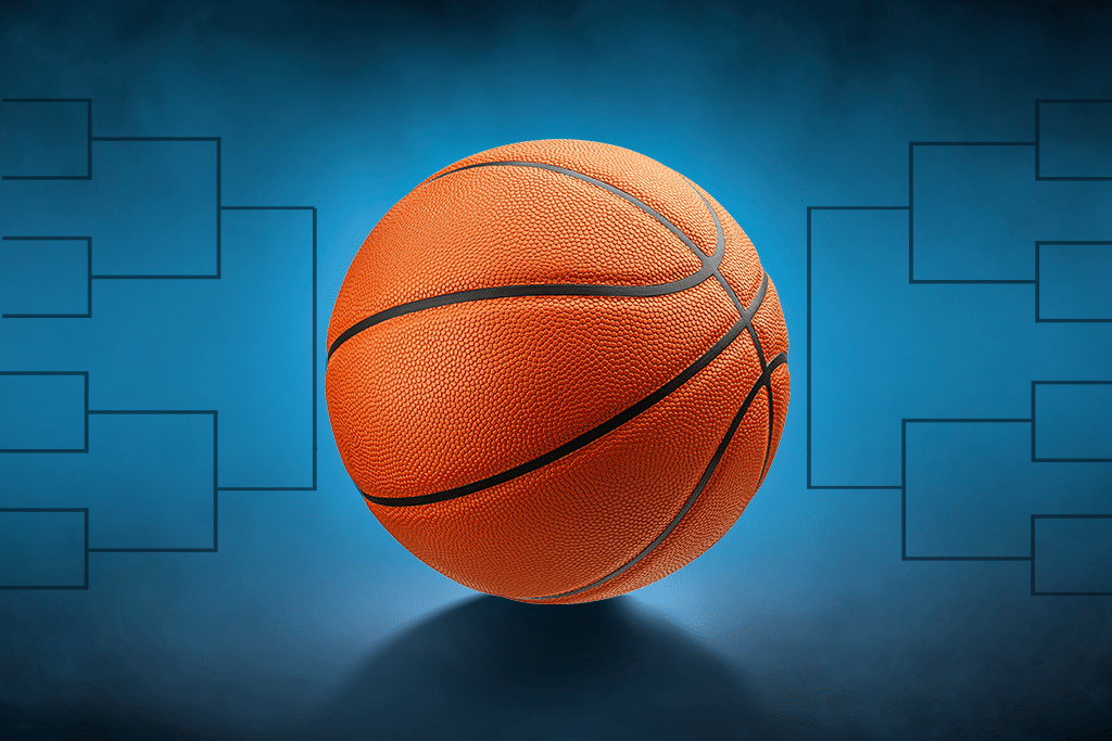 Basketball with competition brackets in the background.