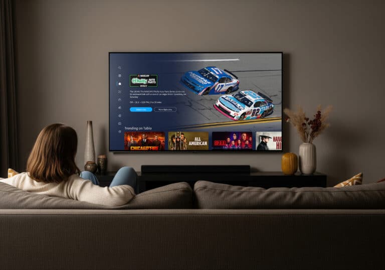 A woman watching the NASCAR channel on Tablo.