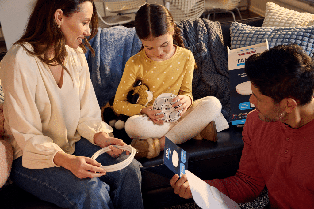 A family opening a Tablo.